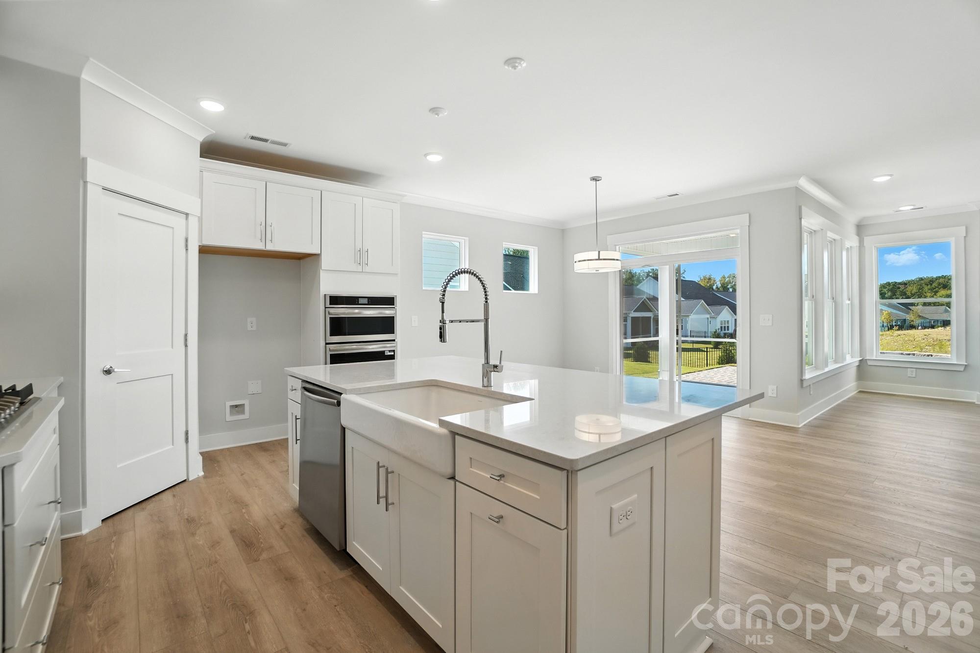 2007 Mantle Rdg Drive Indian Trail, NC 28079 - Photo 6 of 48 a kitchen with stainless steel appliances granite countertop a sink stove and refrigerator