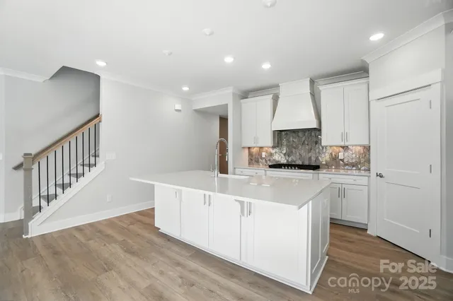 a bathroom with a bathtub and window