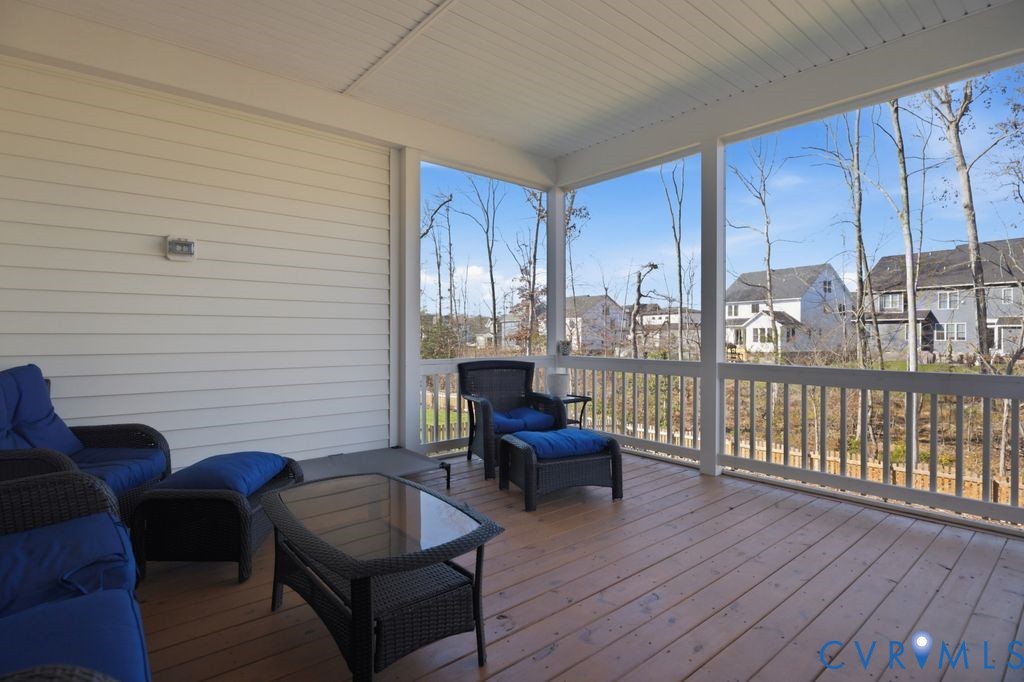 3818 Bellstone Drive Midlothian, VA 23112 - Photo 12 of 35 a living room with furniture and a floor to ceiling window