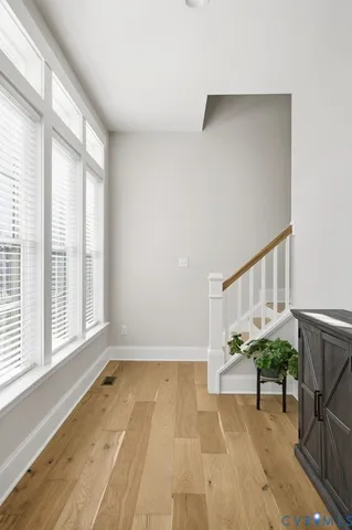 a view of an entryway with wooden floor