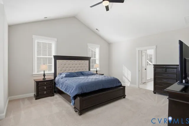 a bedroom with a bed and a television