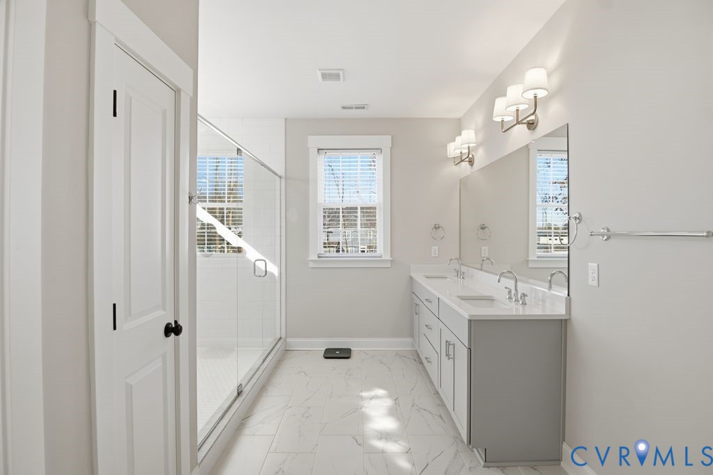 3818 Bellstone Drive Midlothian, VA 23112 - Photo 19 of 35 a spacious bathroom with a double vanity sink a mirror and a shower