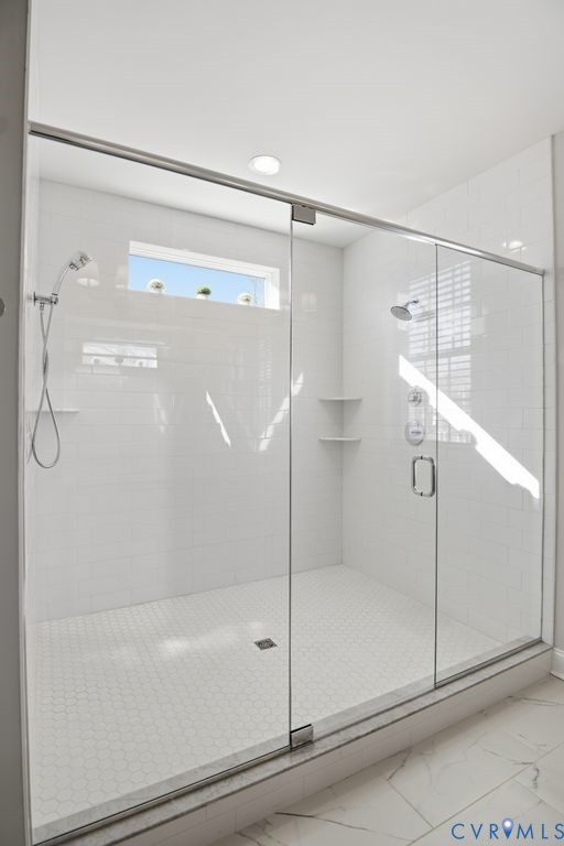 3818 Bellstone Drive Midlothian, VA 23112 - Photo 21 of 35 a bathroom with a glass shower door