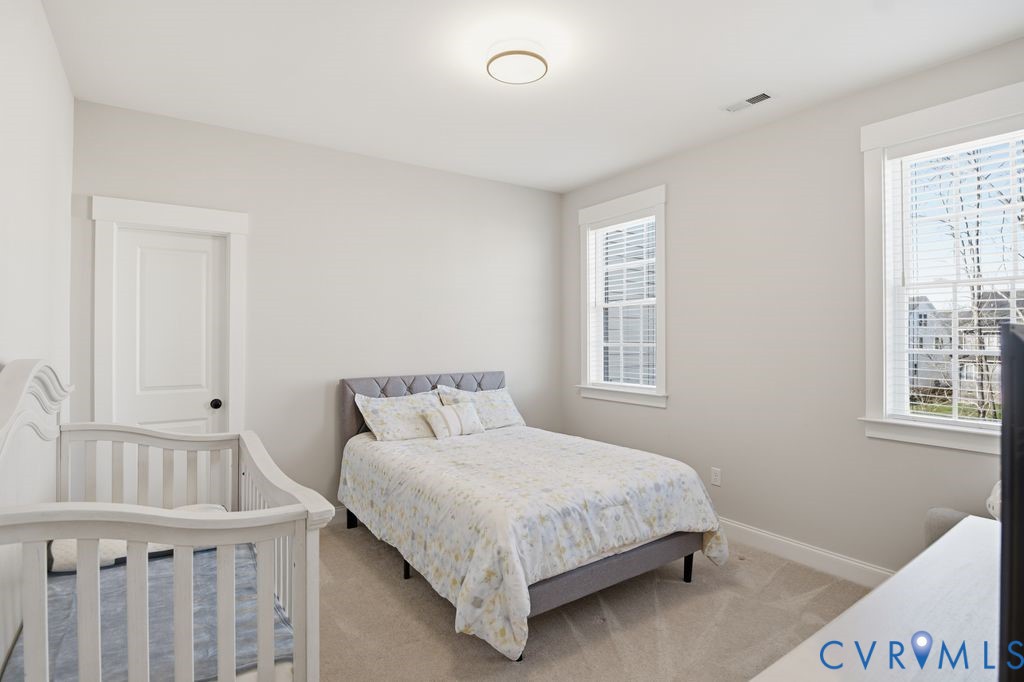 3818 Bellstone Drive Midlothian, VA 23112 - Photo 25 of 35 a bedroom with a bed a window and closet
