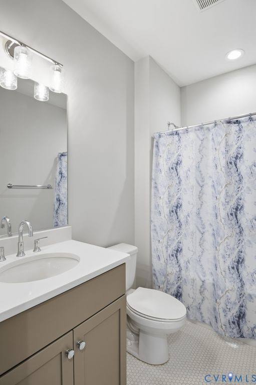 3818 Bellstone Drive Midlothian, VA 23112 - Photo 26 of 35 a bathroom with a sink a toilet and shower curtain