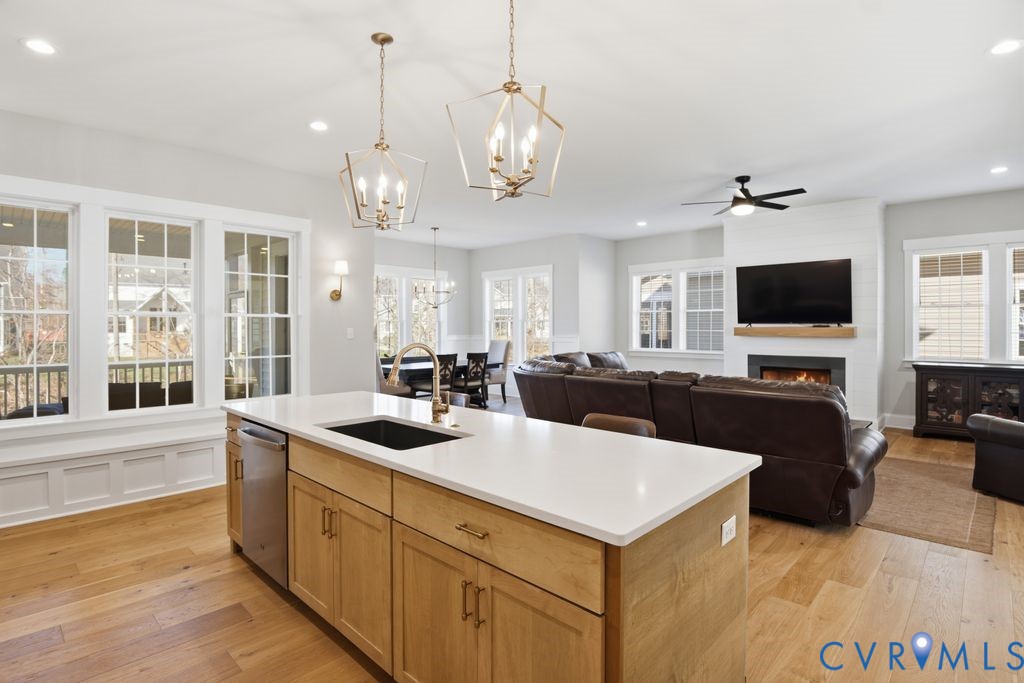 3818 Bellstone Drive Midlothian, VA 23112 - Photo 10 of 35 a large white kitchen with a large island oven a stove and a sink with dishwasher