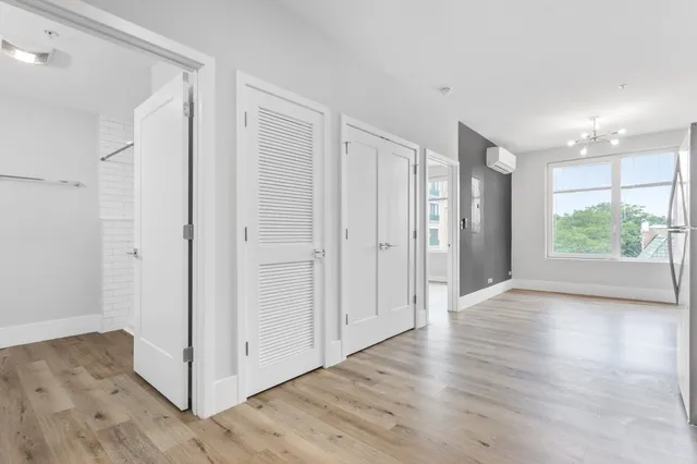 a view of entryway with wooden floor