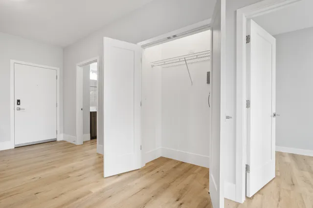 a view of entryway with wooden floor