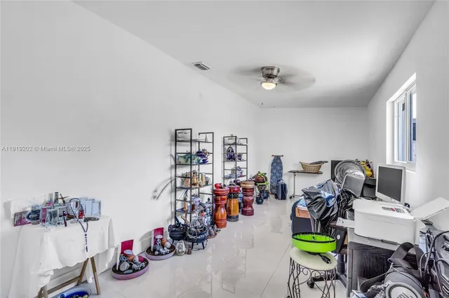 a living room with lots of furniture and gym equipment