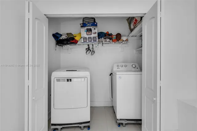 a view of storage and utility room with washer and dryer