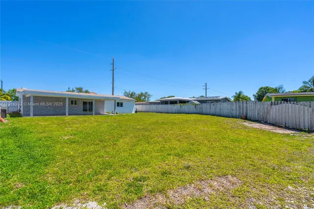 a front view of house with a garden