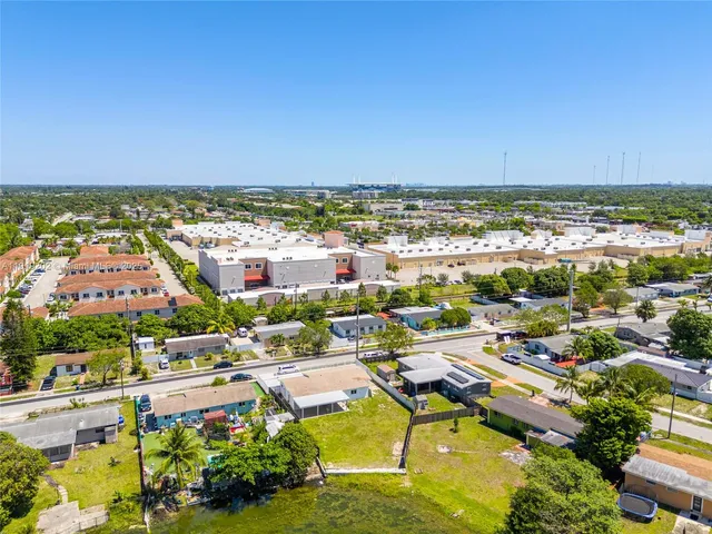 a view of a lake with houses in the background