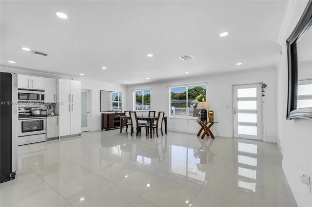 a view of a kitchen with furniture and a living room