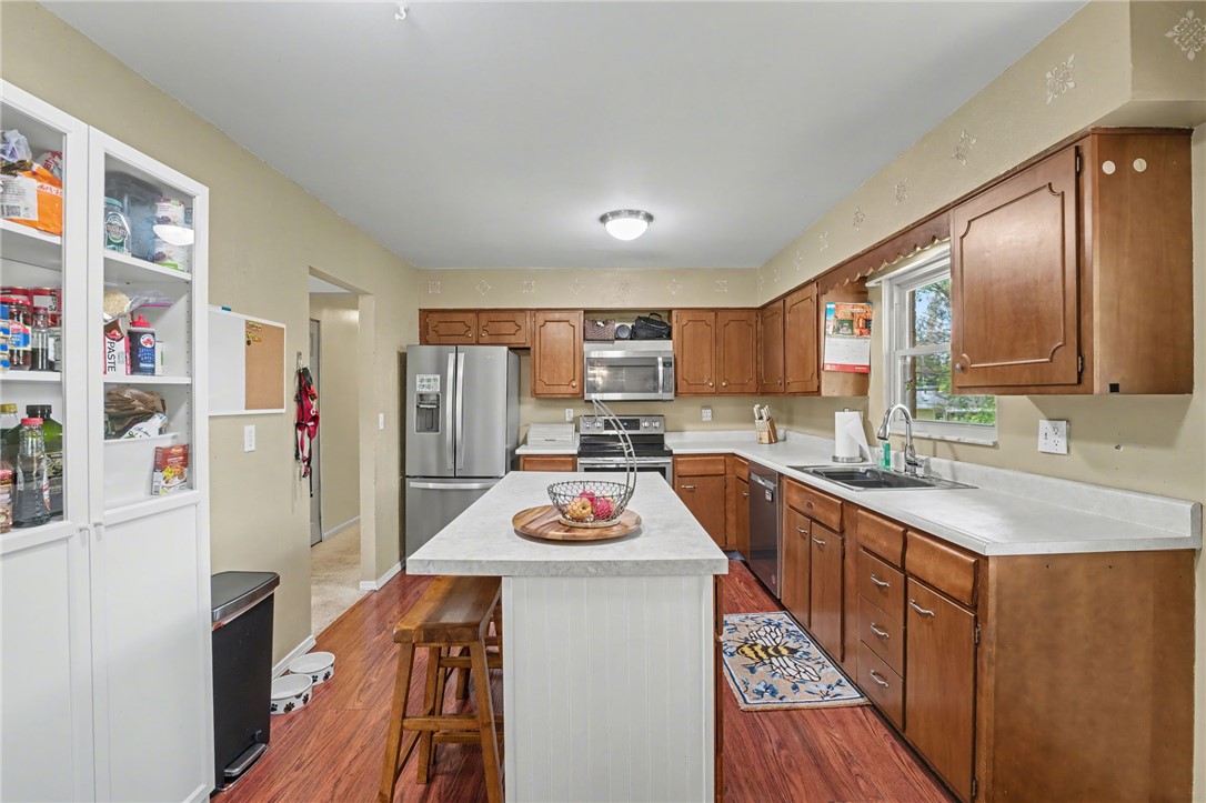 4919 Silver Arrow Drive Riverside, OH 45424 - Photo 14 of 57 This spacious kitchen offers ample counter space and storage, perfect for culinary endeavors.