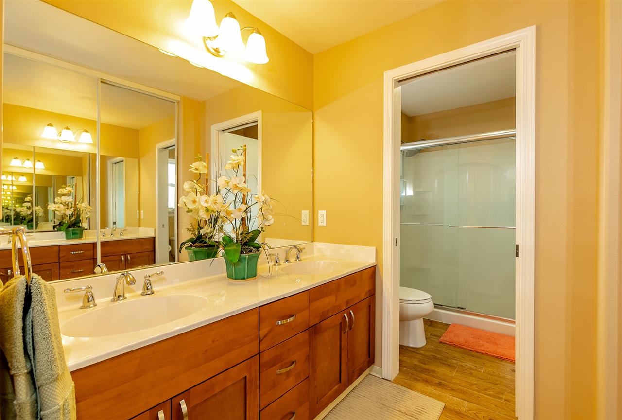 209 Alake Street Kahului, HI 96732 - Photo 17 of 30 a bathroom with a double vanity sink toilet and shower