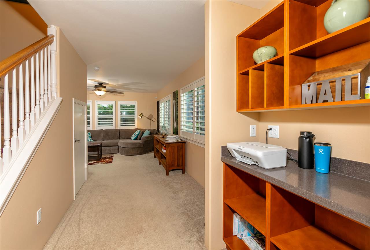 209 Alake Street Kahului, HI 96732 - Photo 9 of 30 a hallway with a couch and chandelier