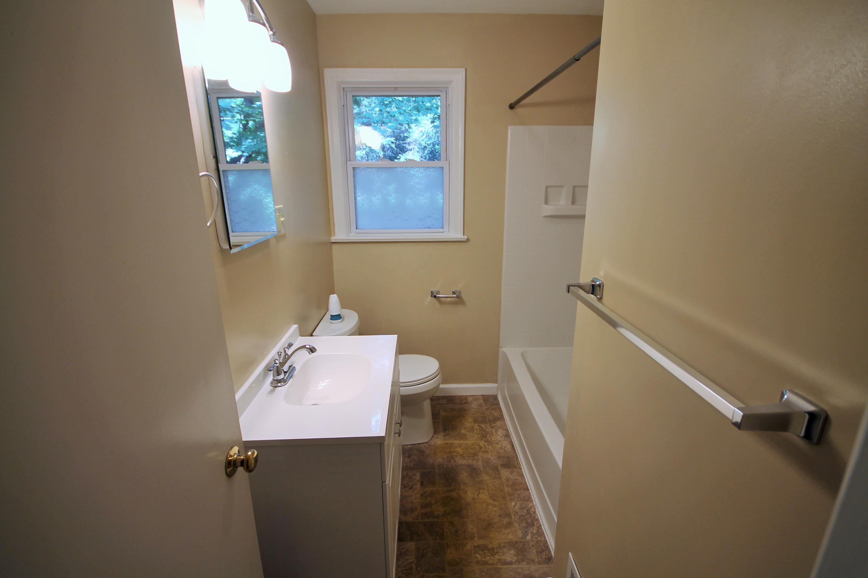 2364 Howard Road Southwest Roanoke, VA 24015 - Photo 12 of 17 a bathroom with a sink a toilet and shower