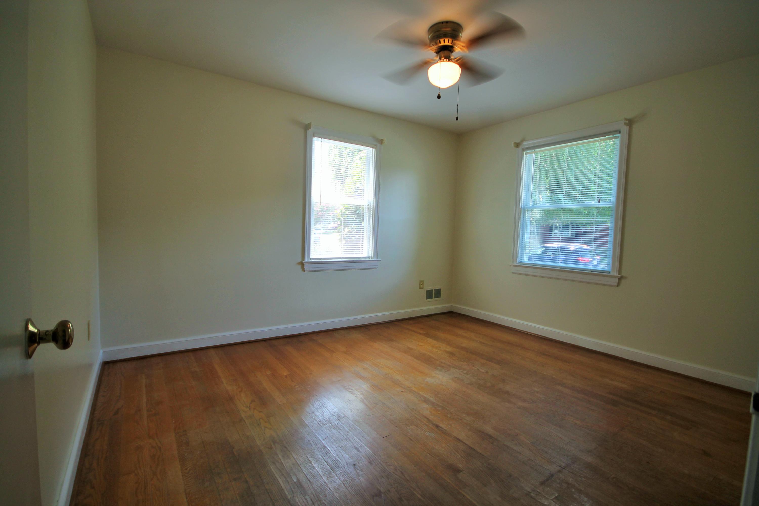 2364 Howard Road Southwest Roanoke, VA 24015 - Photo 13 of 17 a view of an empty room with a window and a chandelier fan