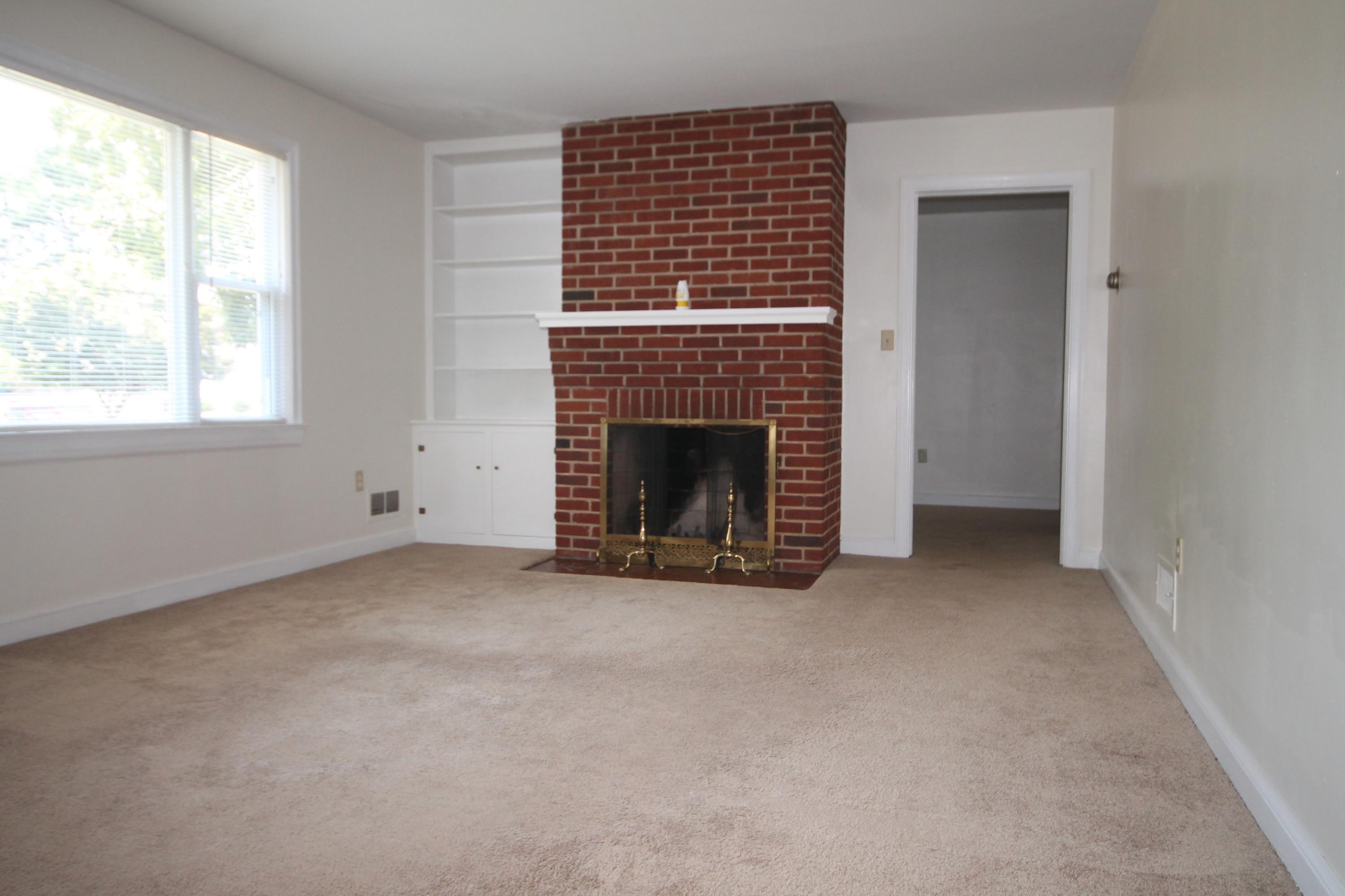 2364 Howard Road Southwest Roanoke, VA 24015 - Photo 7 of 17 an empty room with windows and fireplace
