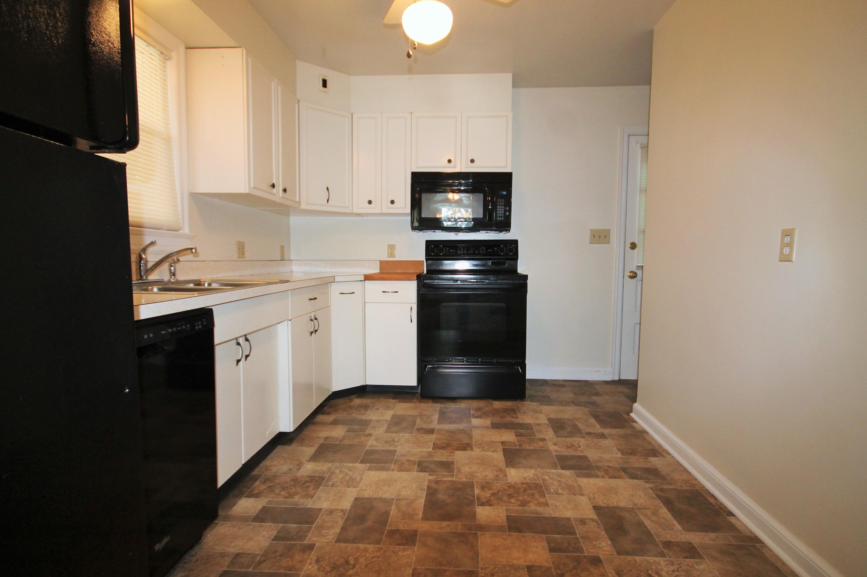 2364 Howard Road Southwest Roanoke, VA 24015 - Photo 9 of 17 a kitchen with a sink appliances and cabinets