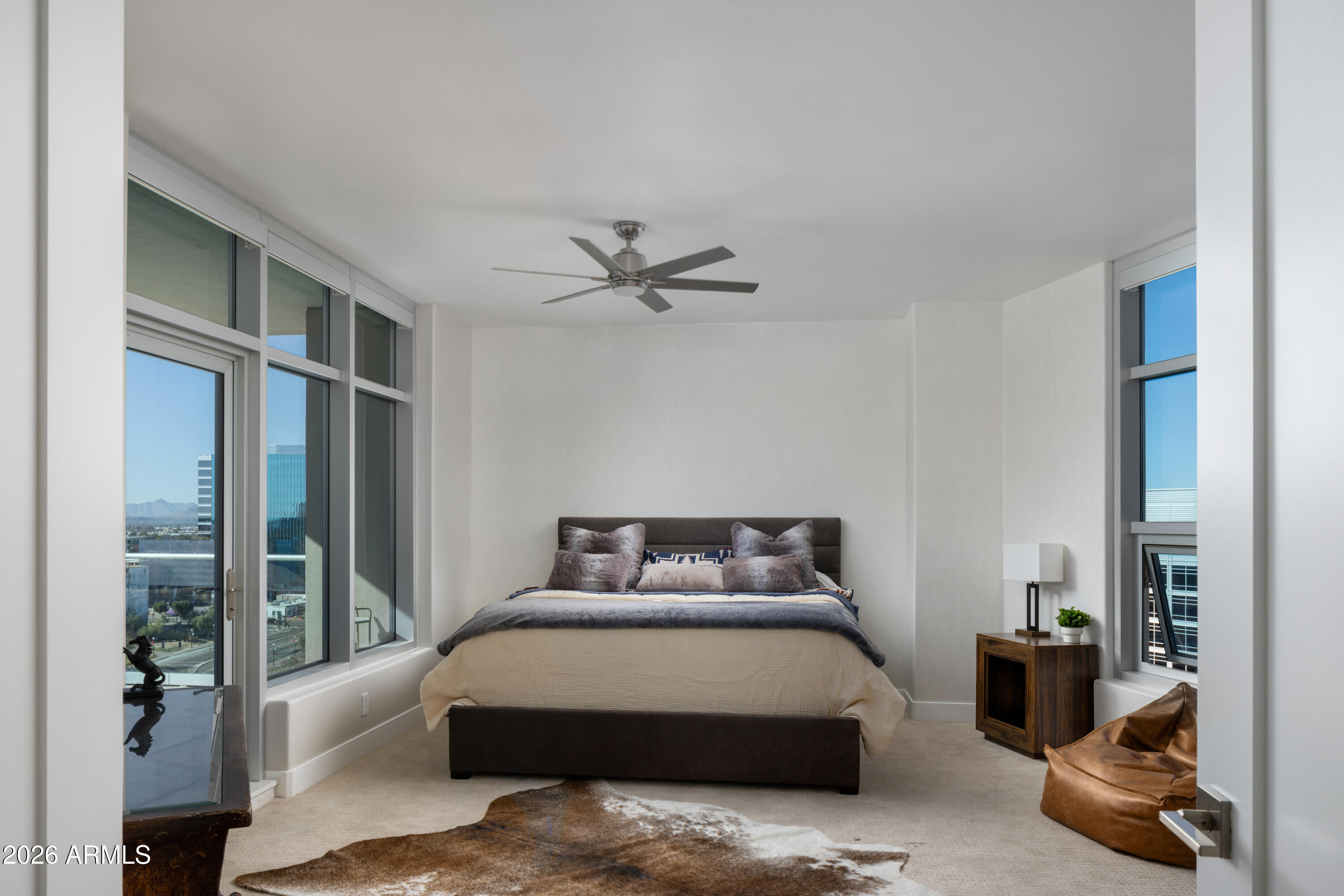 140 East Rio Salado Parkway, Unit 1101 Tempe, AZ 85281 - Photo 11 of 24 a bedroom with a bed and glass window