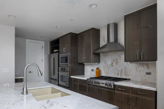 a view of a brick building next to a yard