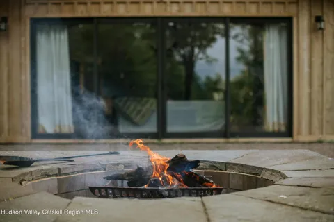 a balcony with furniture and a potted plant