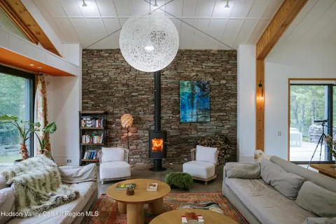 a living room with furniture a lamp and a fireplace