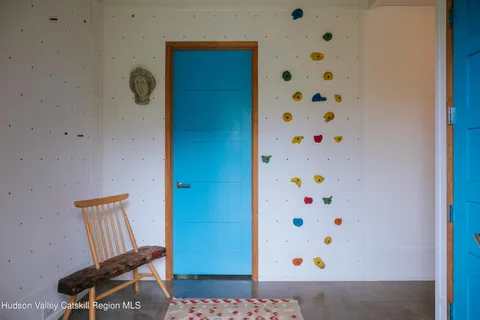 a view of a hallway with furniture