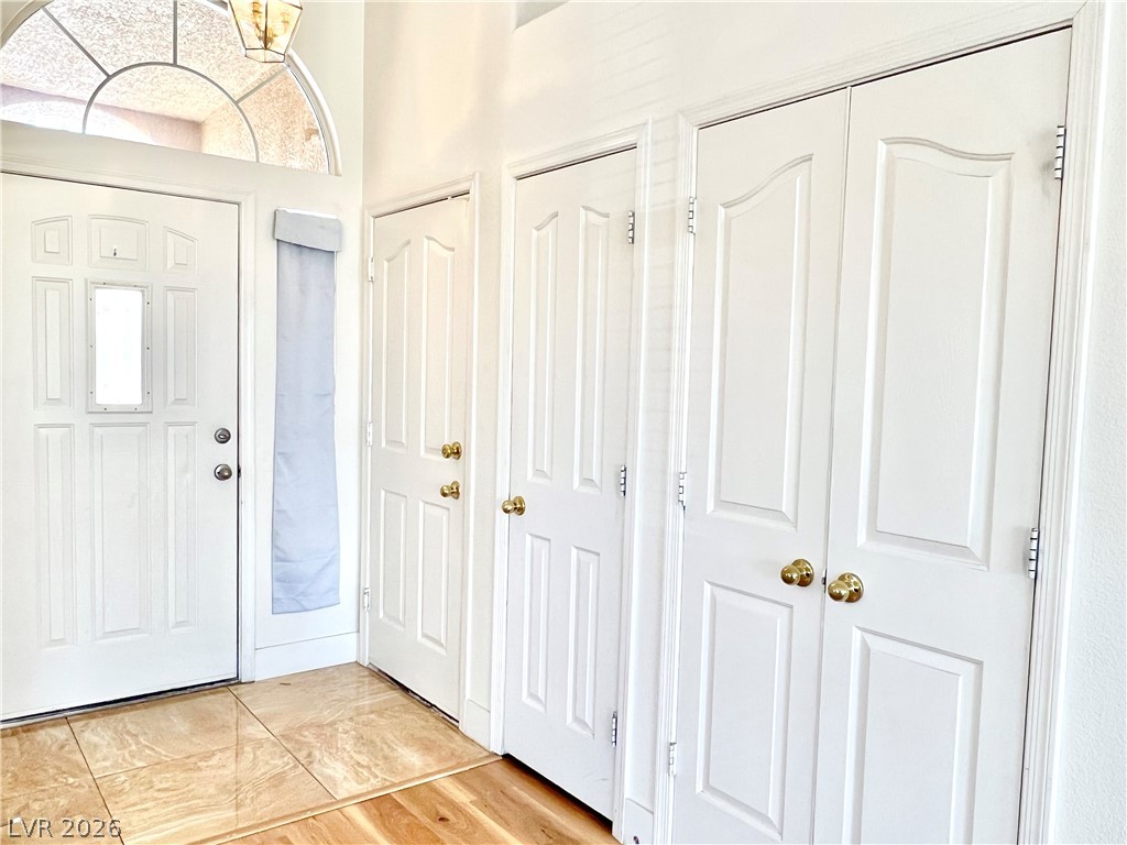 9708 Ridge Creek Place Las Vegas, NV 89134 - Photo 13 of 34 A welcoming entryway with various doors and a decorative arched transom.