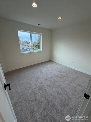 a bathroom with a sink vanity mirror and toilet