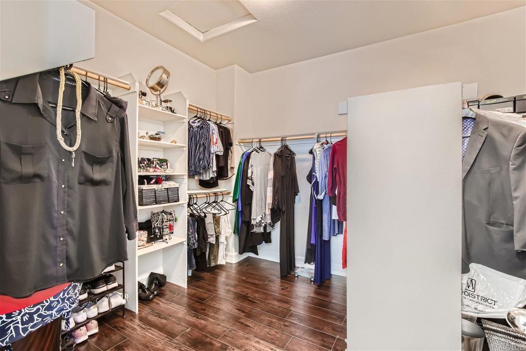 431 Machado Way Vista, CA 92083 - Photo 20 of 36 a view of walk in closet with clothes and shoes