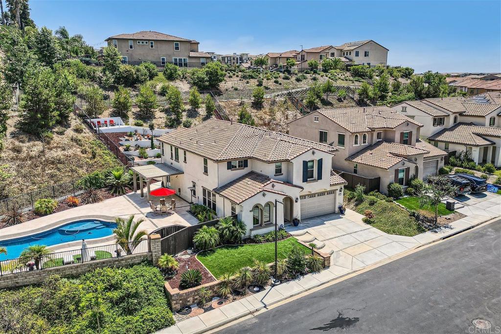 431 Machado Way Vista, CA 92083 - Photo 2 of 36 an aerial view of a house with a yard and a large pool