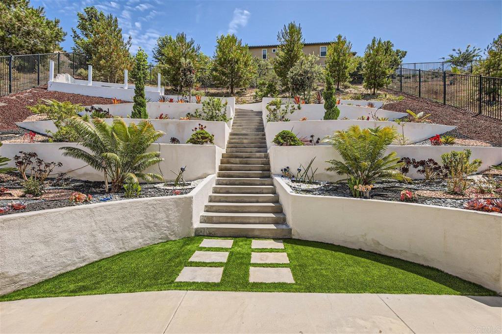 431 Machado Way Vista, CA 92083 - Photo 32 of 36 a view of a backyard with sitting area