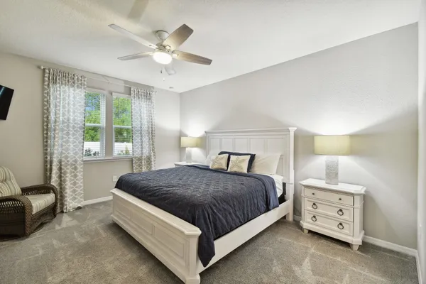 a bedroom with a bed and furniture