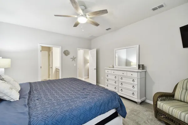 a bathroom with a glass shower door and a shower