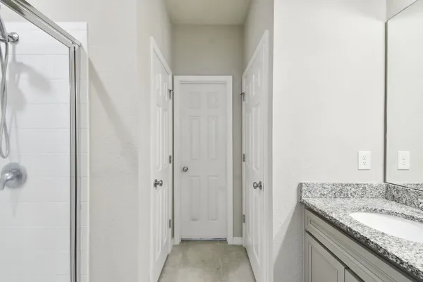 a view of walk in closet with clothes