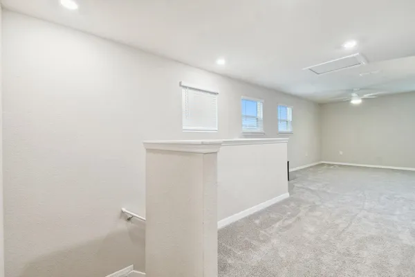 a bathroom with a granite countertop sink a toilet and a mirror