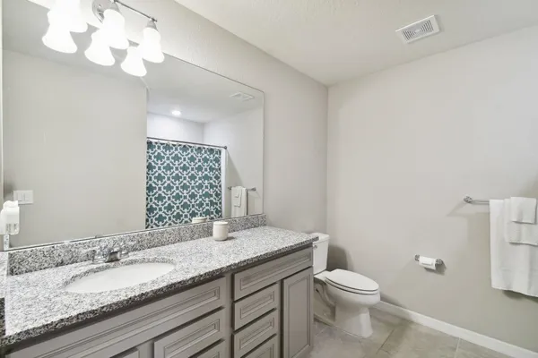 a bedroom with a bed and a cabinets