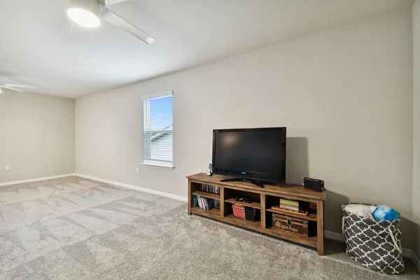 a view of an outdoor dining space with a table and chairs