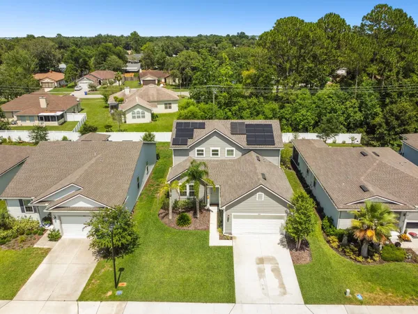 an aerial view of a house with a garden
