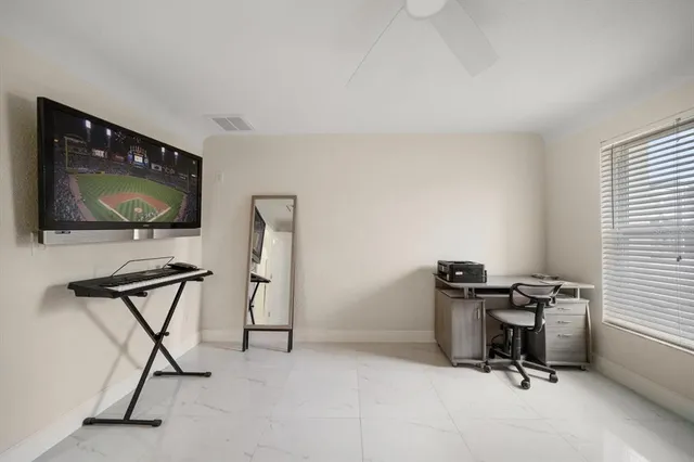 a view of a swimming pool with a patio