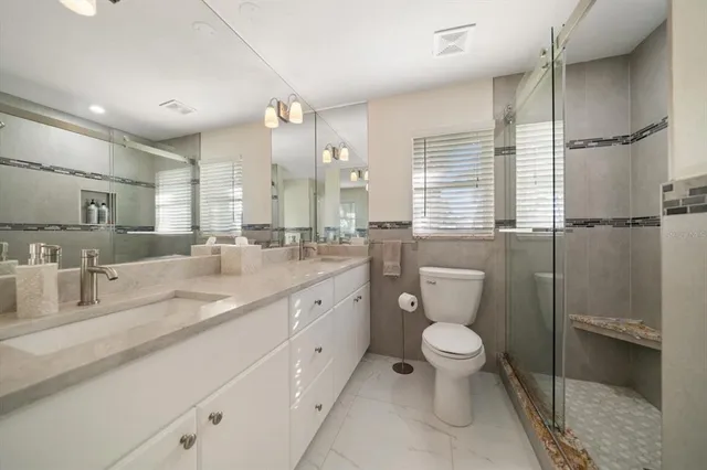 a view of a balcony with two chairs and a table