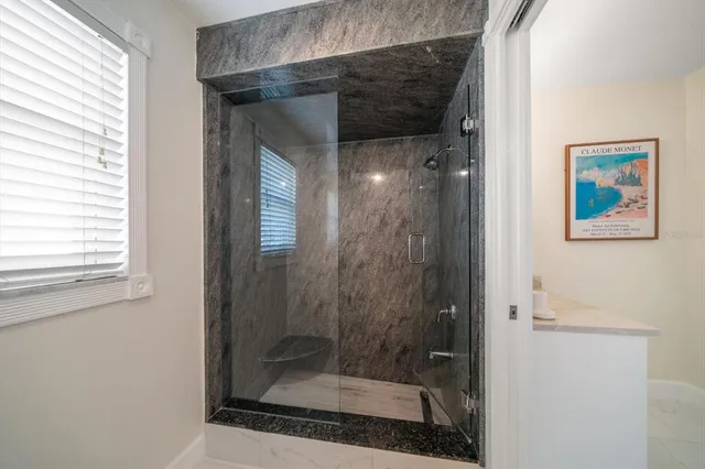 a view of a patio with dining table and chairs with wooden floor