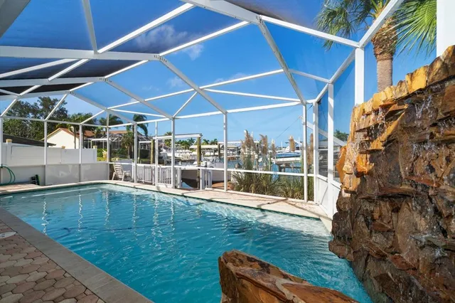 an aerial view of lake residential house with outdoor space and seating