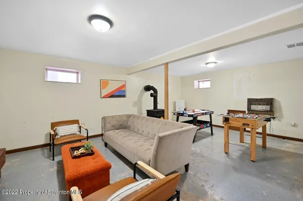 a living room with dining table and a table