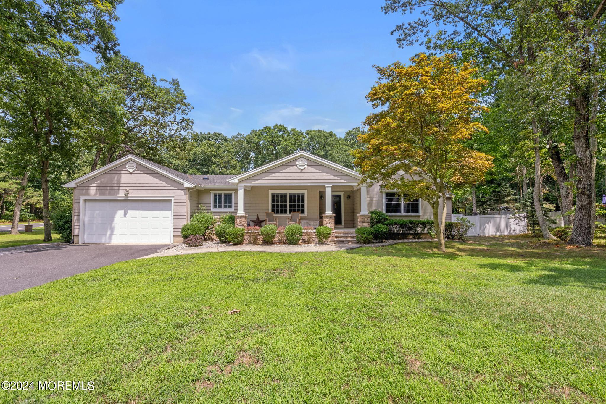 343 Easy Street Howell, NJ 07731 - Photo 1 of 53 a front view of a house with yard and green space