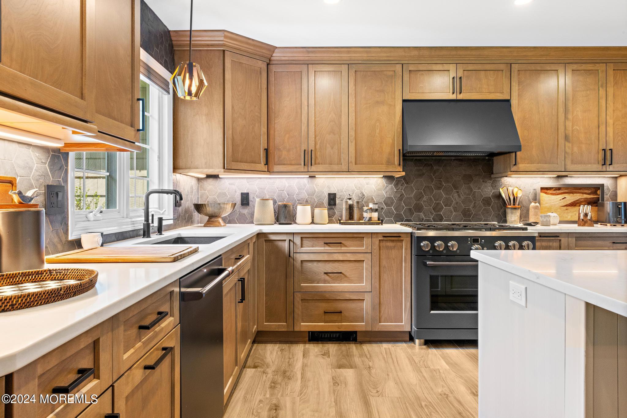 343 Easy Street Howell, NJ 07731 - Photo 13 of 53 a kitchen with a stove sink and cabinets