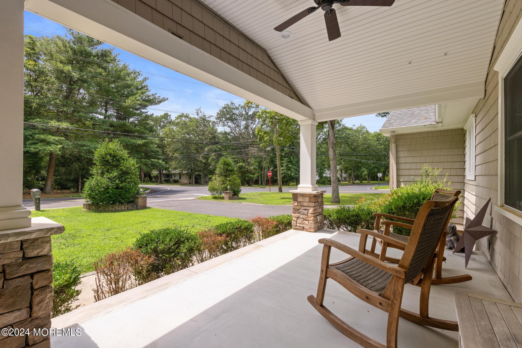 343 Easy Street Howell, NJ 07731 - Photo 2 of 53 a view of a patio with table and chairs near a garden