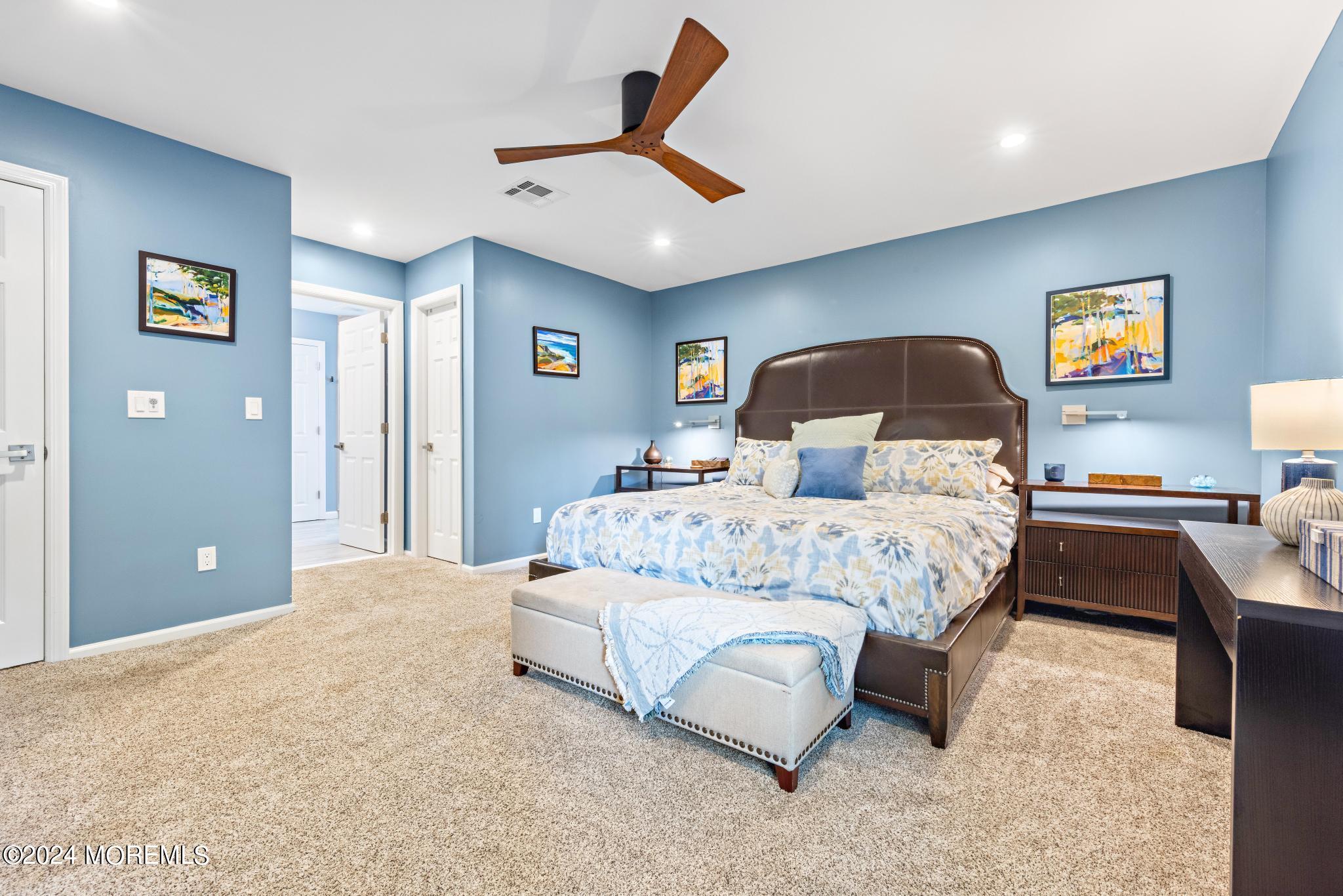 343 Easy Street Howell, NJ 07731 - Photo 21 of 53 a bedroom with a bed and painting on the wall